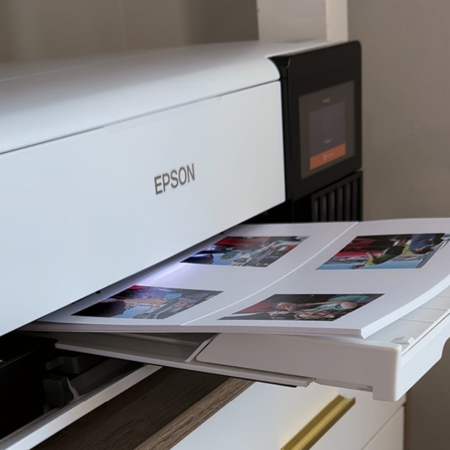 Epson printer in the process of printing photos for custom magnets