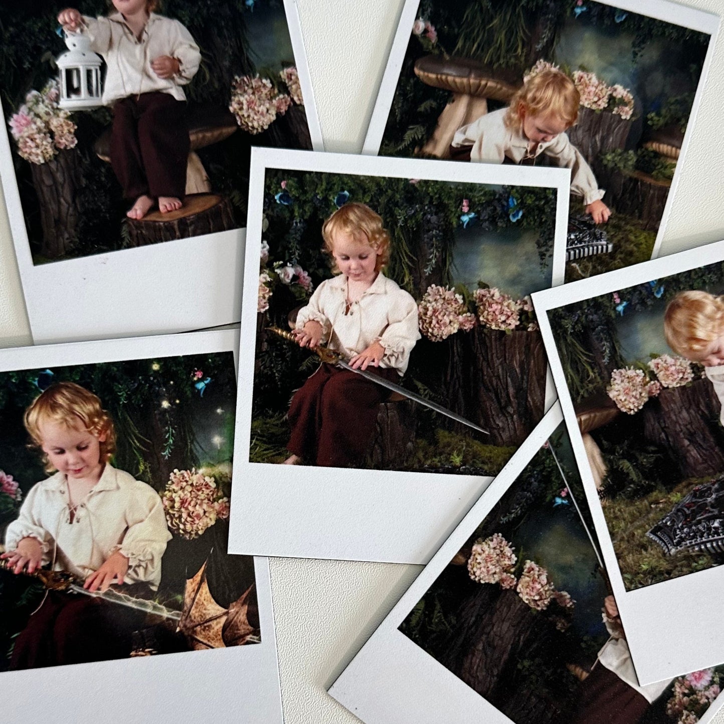 Collage of Polaroid-style photos of a child playing with flowers and a toy sword.