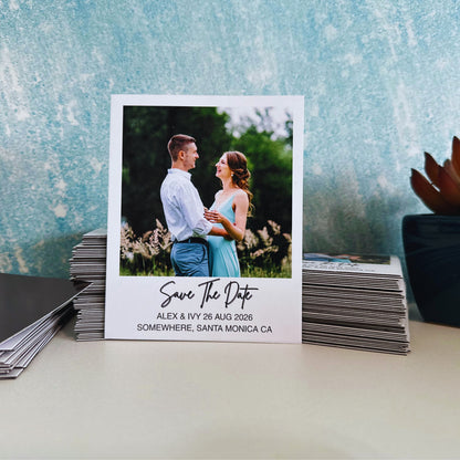 Wedding save the date magnet with a couple photo on a textured surface